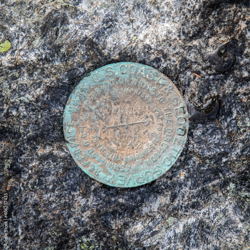 Φωτογραφία Closeup of summit geological survey marker on the op of Mount Marcy, Adirondacks