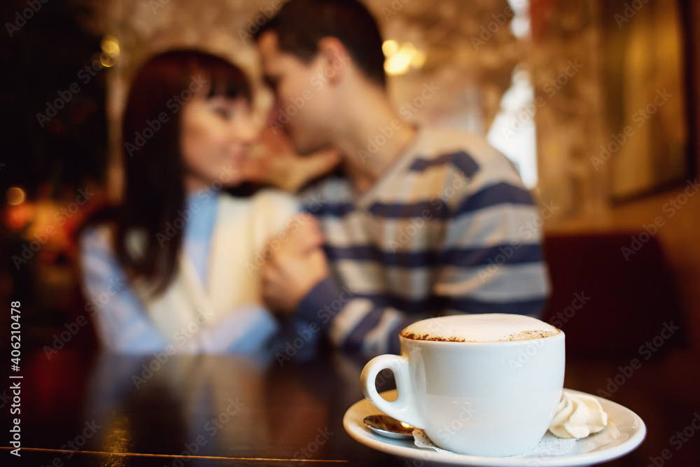 man and woman sitting in a cafe on a date. young couple in love man and woman sitting in a cafe on a date. young couple in love
