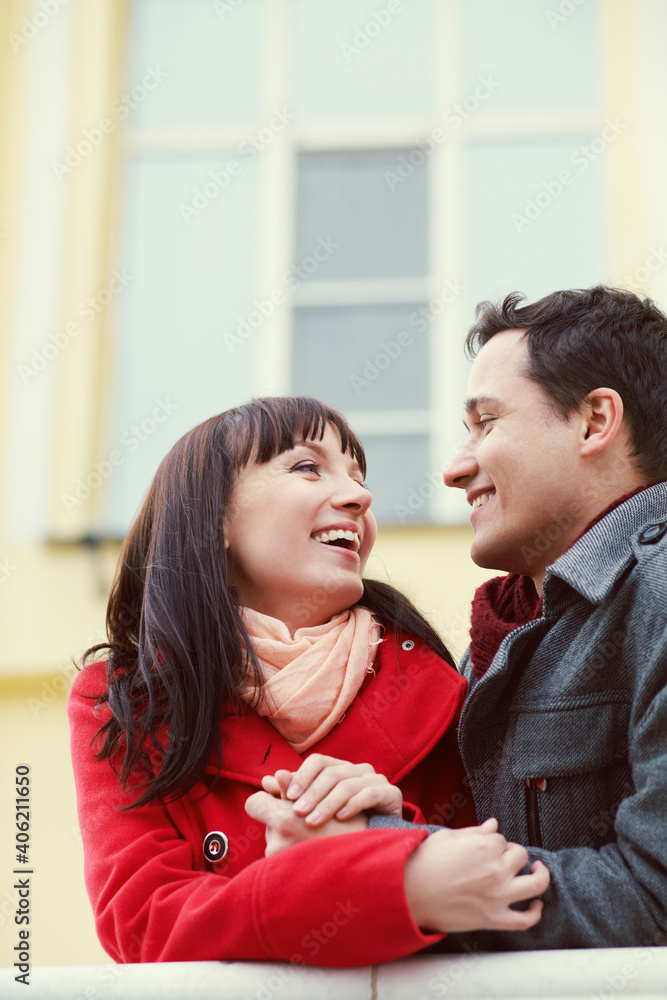 Young happy couple in love outdoors. loving man and woman walking in a city. Young happy couple in love outdoors. loving man and woman walking in a city.