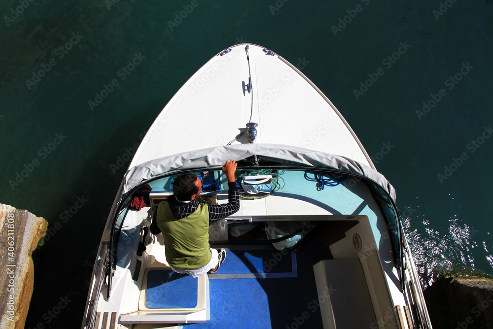 aerial view of a boy driving a boat
