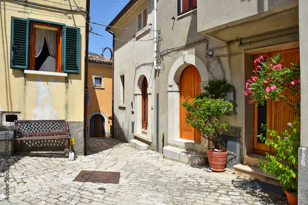 A narrow street between the stone houses of Morcone, an old town in the province of Benevento, Italy.

