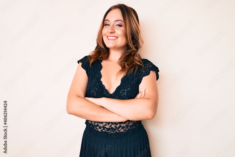 Young beautiful caucasian woman wearing elegant clothes happy face smiling with crossed arms looking at the camera. positive person. Young beautiful caucasian woman wearing elegant clothes happy face smiling with crossed arms looking at the camera. positive person.