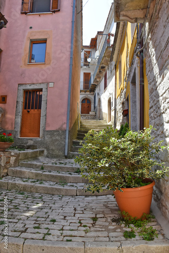 A narrow street between the stone houses of Morcone, an old town in the province of Benevento, Italy. 