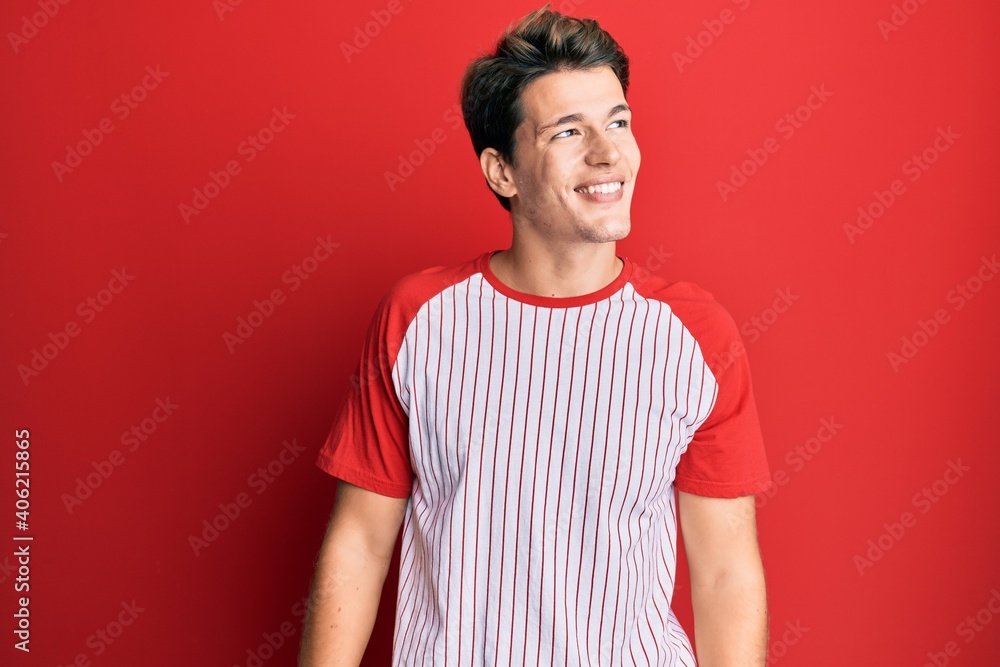 Handsome caucasian man wearing baseball uniform looking to side, relax profile pose with natural face and confident smile. Handsome caucasian man wearing baseball uniform looking to side, relax profile pose with natural face and confident smile.