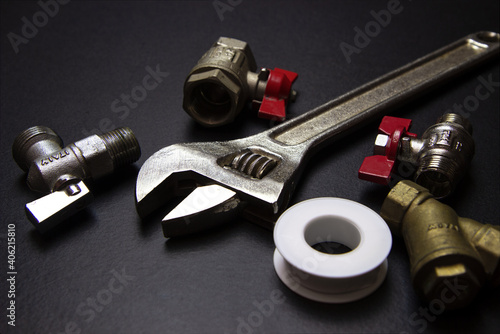 plumbing tools and equipment on black background