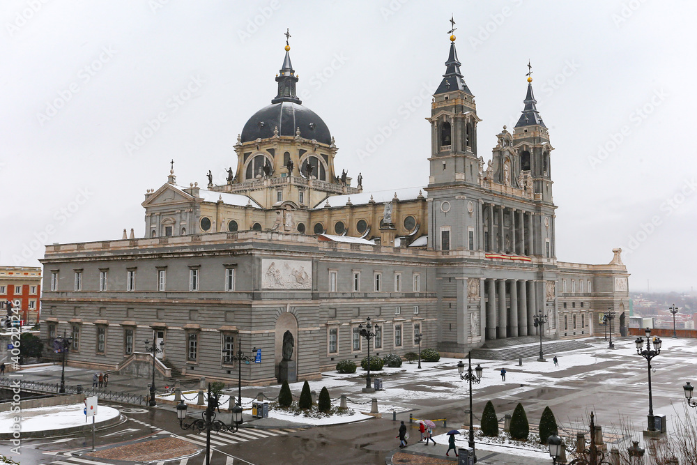 Almudena Cathedral in Madrid covered by snow and cold from the storm Filomena. Great snowfall in Madrid. Snow storm.