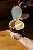 Person pouring coffee