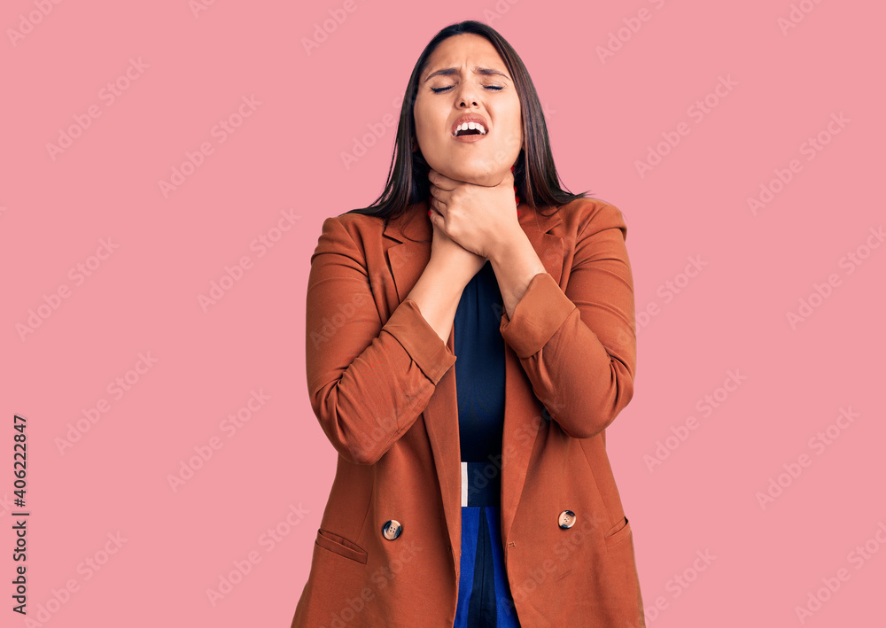 Young beautiful brunette woman wearing elegant clothes shouting and suffocate because painful strangle. health problem. asphyxiate and suicide concept. Young beautiful brunette woman wearing elegant clothes shouting and suffocate because painful strangle. health problem. asphyxiate and suicide concept.