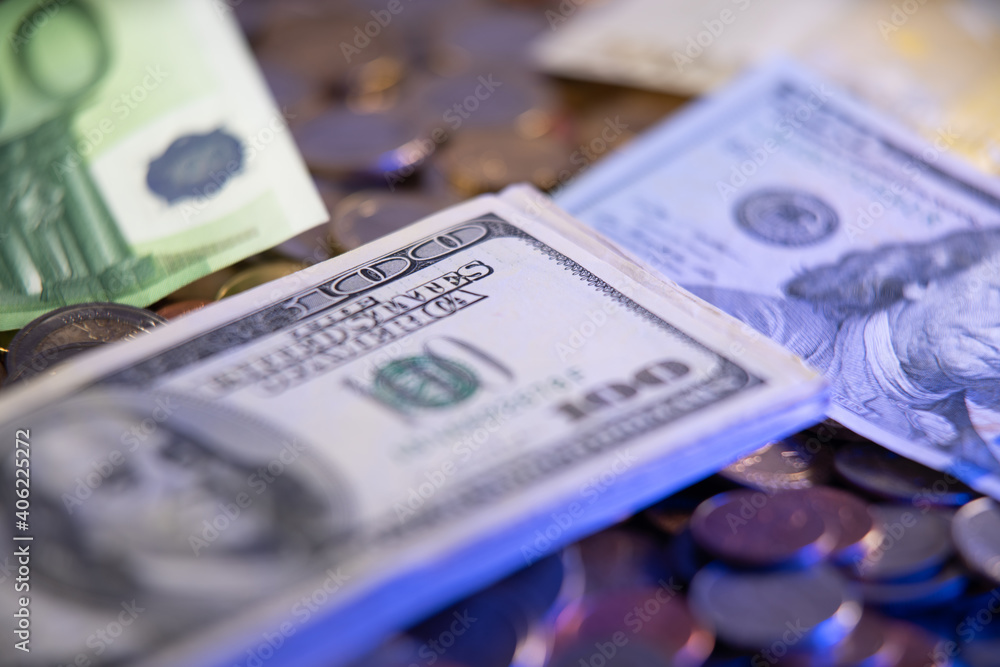 Fototapeta premium United States Federal Reserve currencies. Dollars next to Euro Banknotes. Paper Money and metal Money