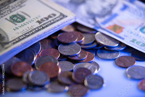 New and Old 100 Dollar bills on top of cent coins of United states federal reserve. USA Cash