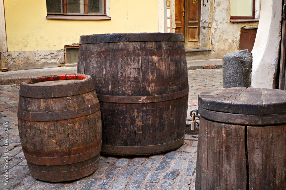 Old wooden barrels on a street in Riga, Latvia.