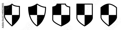 Vector set of shields. Protection icons. Vector set of black shields in flat style isolated on white background. Defense icons. Vector illustrations.