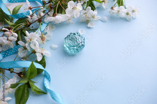 postcard layout. springtime. blossoming cherry branch and space for text. congratulation. invitation
