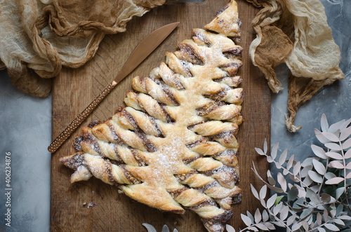 Puff pastry Christmas tree with chocolate paste and nuts