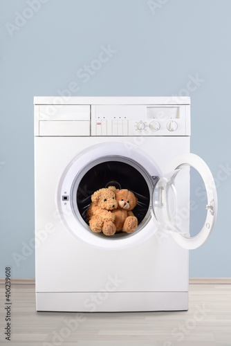 Teddy bears hugging in washing machine