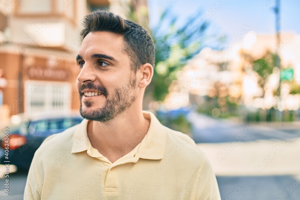 Young hispanic man smiling happy walking at the city. Young hispanic man smiling happy walking at the city.