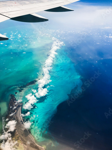 Caribbean sea from a plane. Awesome sky view of Bahamas with textured blue water. Turquoise water from a plane. 