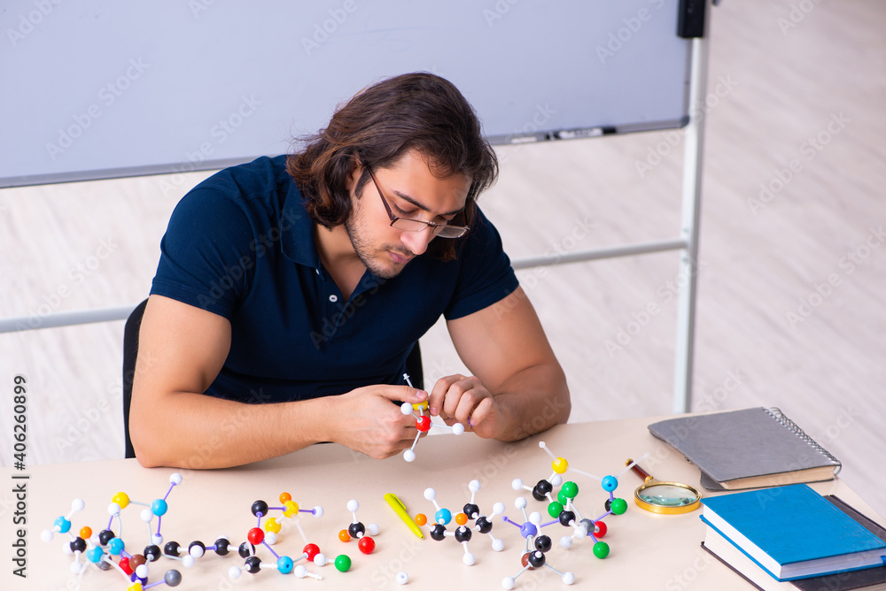 Young male scientist sitting in the classroom Young male scientist sitting in the classroom