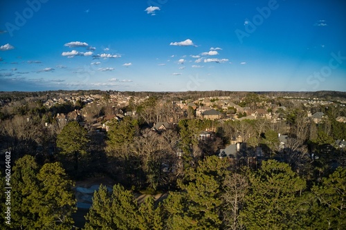 Aerial view of an upscale subdivision in suburbs shot during golden hour