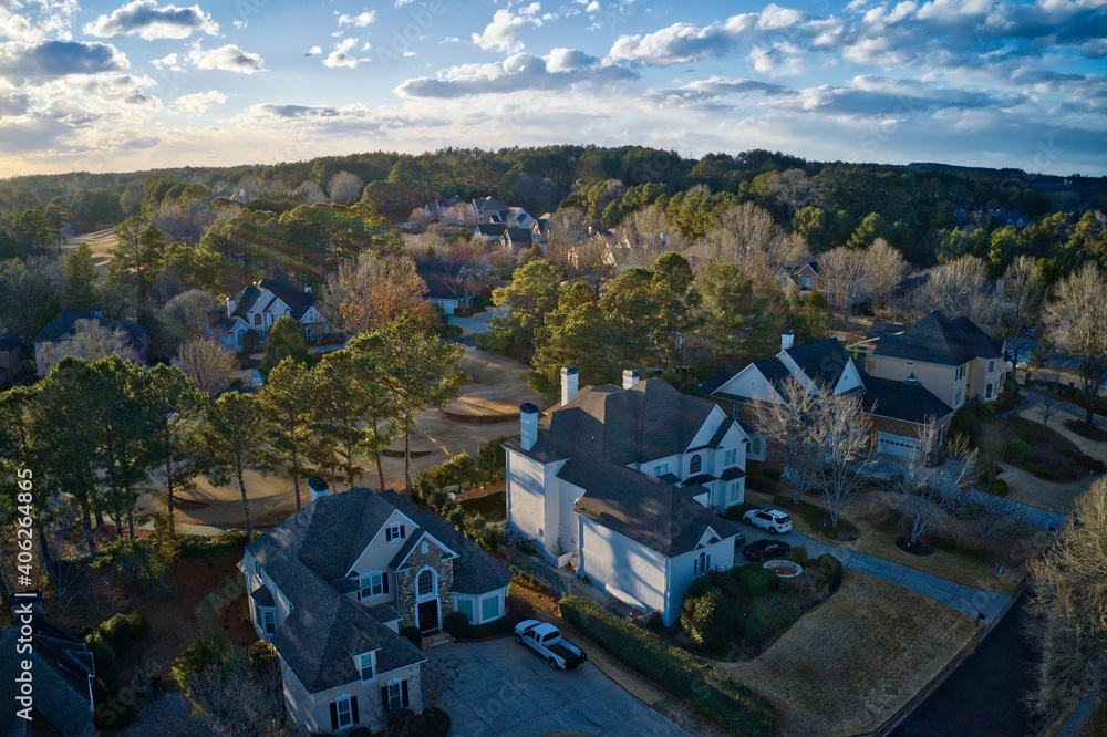 Aerial view of an upscale subdivision in suburbs shot during golden hour Aerial view of an upscale subdivision in suburbs shot during golden hour