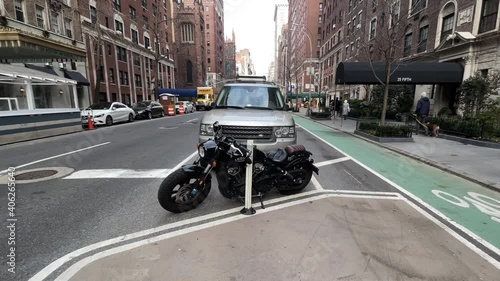 man riding on bicycle on bike lane in Manhattan NYC photo