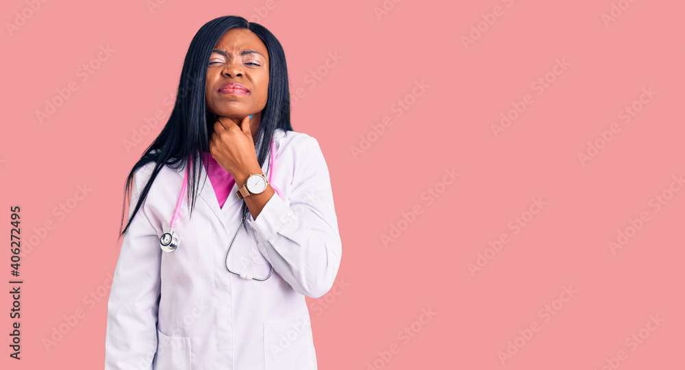 Young african american woman wearing doctor stethoscope touching painful neck, sore throat for flu, clod and infection