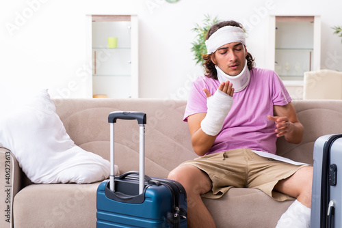 Young injured man preparing for the trip