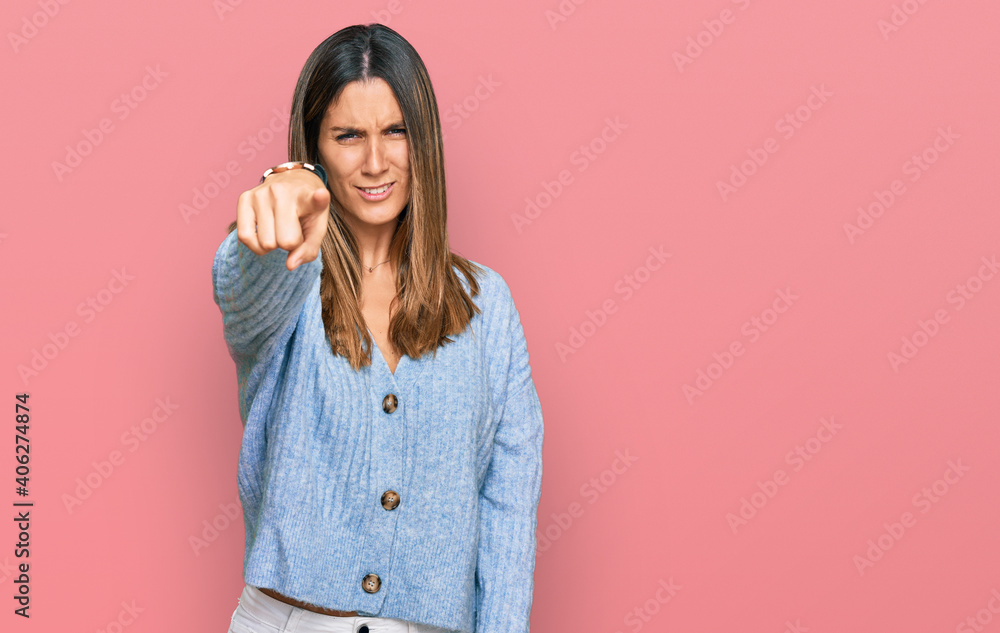 Young woman wearing casual clothes pointing displeased and frustrated to the camera, angry and furious with you Young woman wearing casual clothes pointing displeased and frustrated to the camera, angry and furious with you