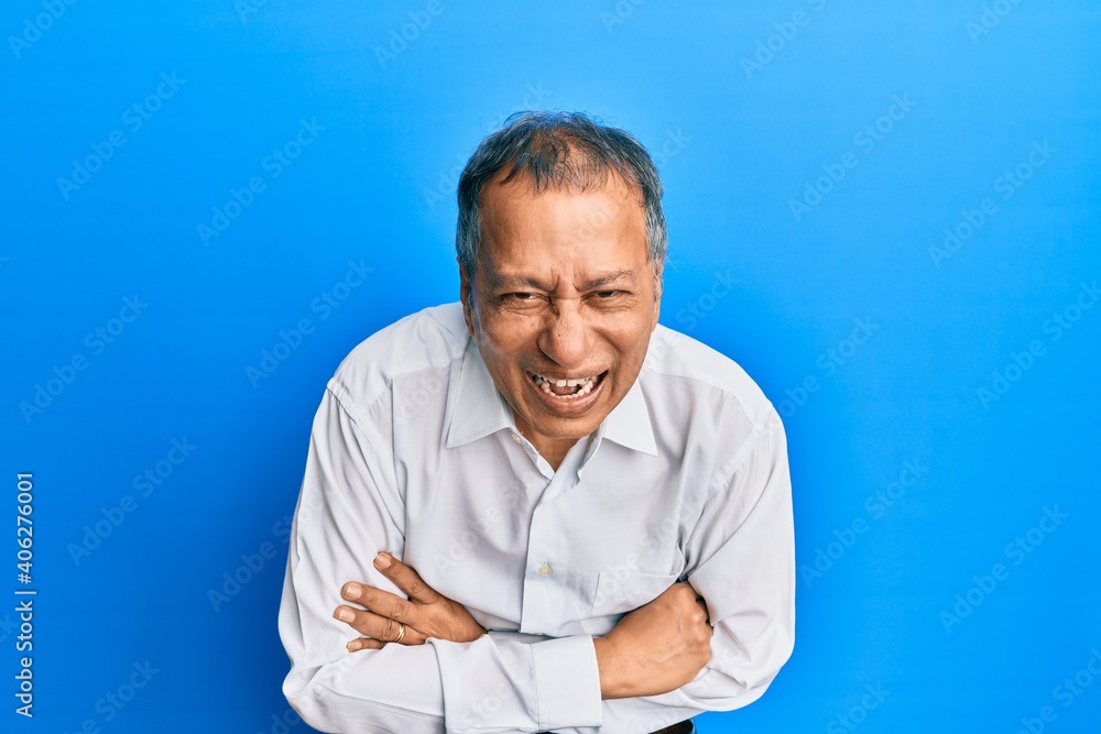 Middle age indian man with arms crossed gesture smiling and laughing hard out loud because funny crazy joke. Middle age indian man with arms crossed gesture smiling and laughing hard out loud because funny crazy joke.