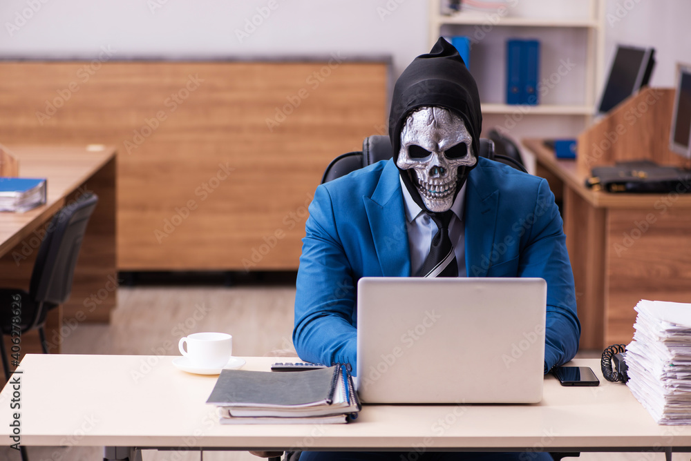 Devil businessman working in the office Devil businessman working in the office