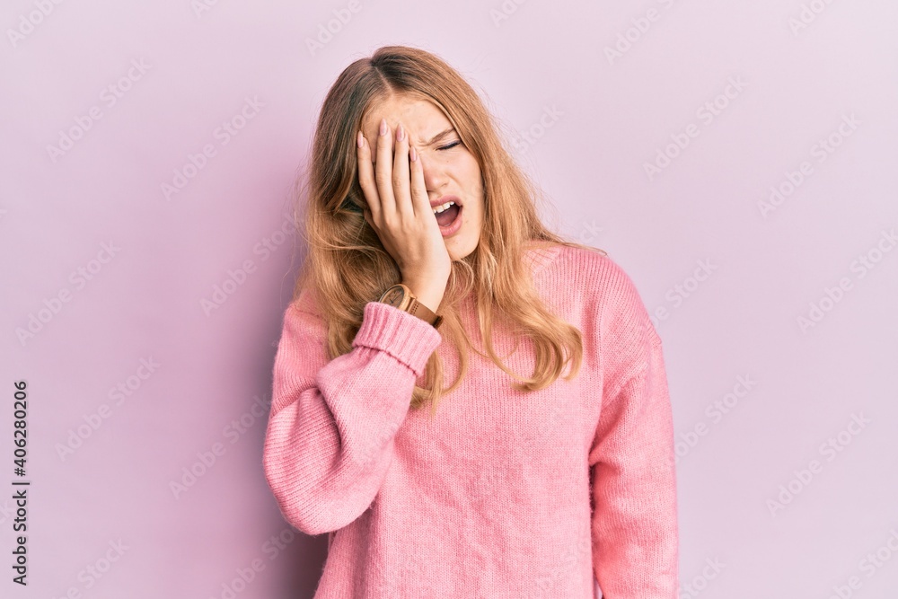 Beautiful young caucasian girl wearing casual clothes yawning tired covering half face, eye and mouth with hand. face hurts in pain. Beautiful young caucasian girl wearing casual clothes yawning tired covering half face, eye and mouth with hand. face hurts in pain.