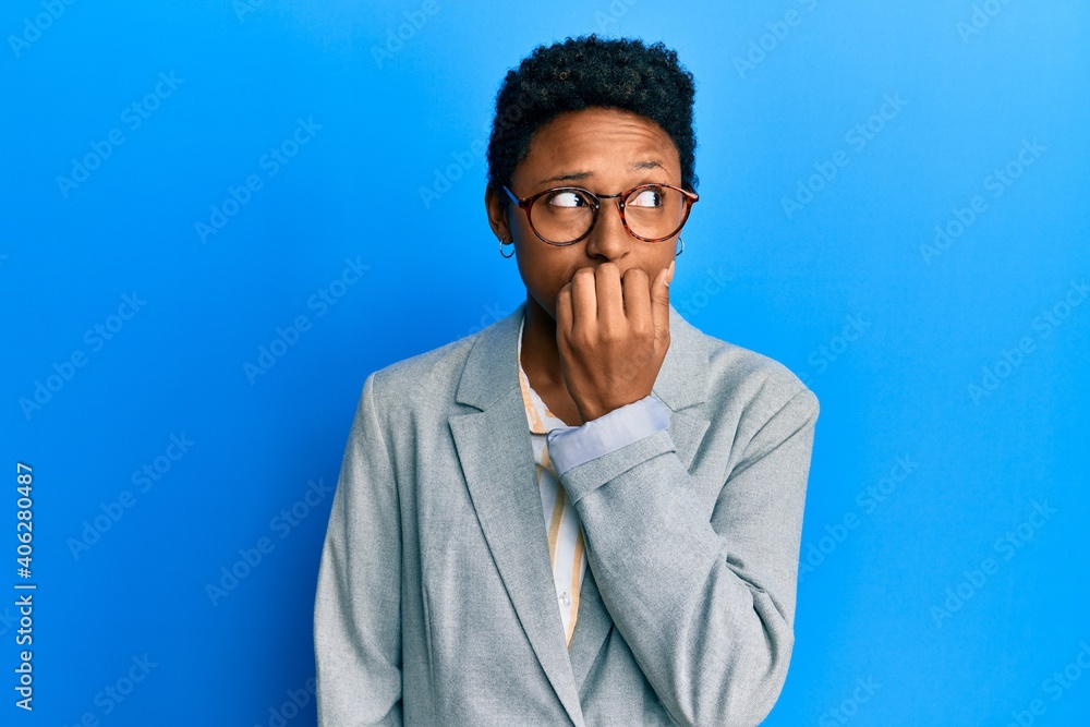 Ταπετσαρία Young african american girl wearing business jacket and glasses looking stressed and nervous with hands on mouth biting nails