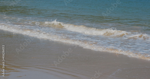 Sea wave over sand beach