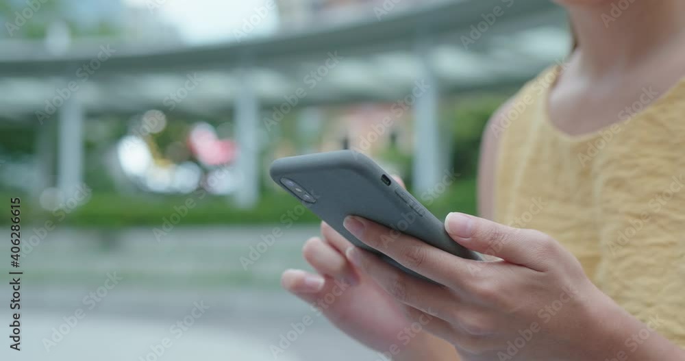 Woman use of cellphone at outdoor Woman use of cellphone at outdoor