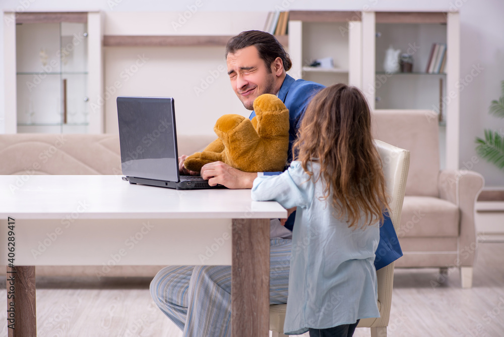 Girl bothering young father during working from house in pandemi Girl bothering young father during working from house in pandemi