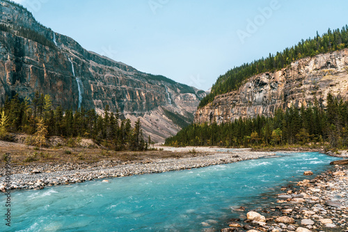 Glacial turquoise river with mountains © Martin