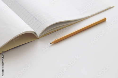 Blank empty notepad and pencil on desk