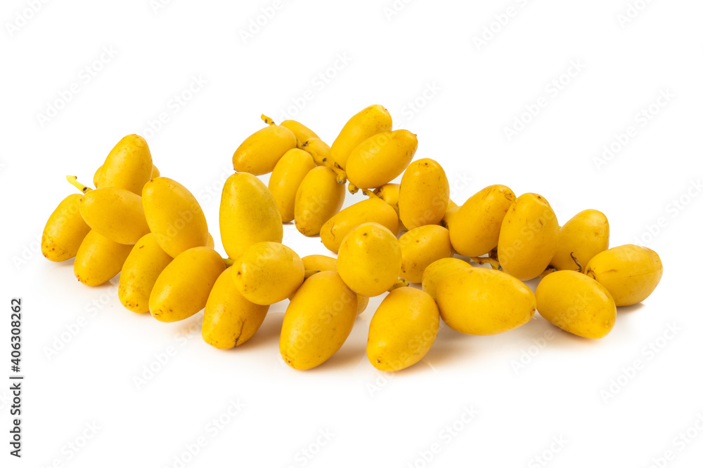 Fototapeta premium Bunch of yellow raw Date Fruit or Medjool Dates (Phoenix dactylifera) from the palm tree isolated on White Background.Healthy lifestyle and Vegetarian concept