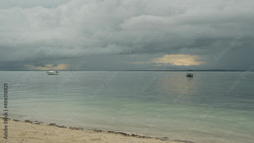 Two sport boast anchored in calm lagoon Two sport boast anchored in calm lagoon
