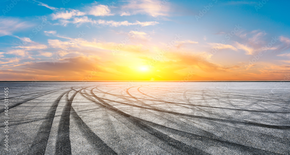 Asphalt race track road and sky clouds at sunset.Road ground background. Asphalt race track road and sky clouds at sunset.Road ground background.