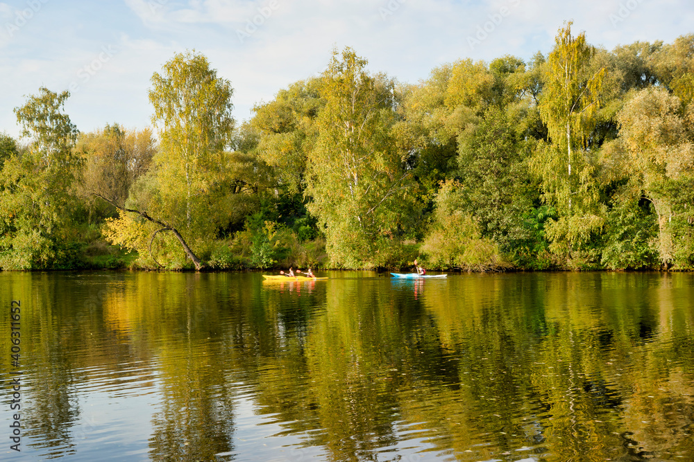 Kayaking on the river. Autumn trees. Park zone in Strogino, Moscow - September 24, 2020