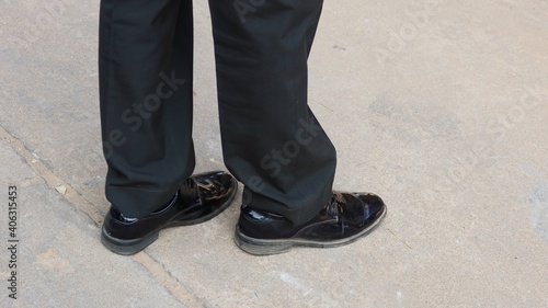man in black shoes