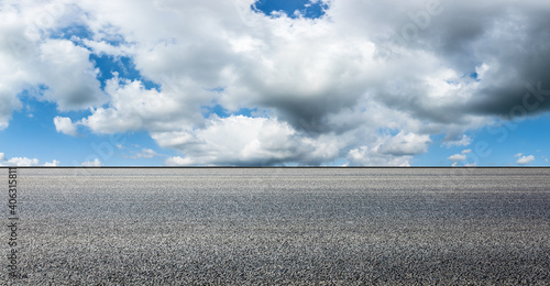 Empty asphalt road and blue sky with white clouds.Road background. © ABCDstock