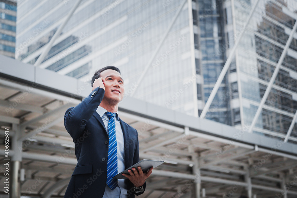 Businessman and businesswoman discussing work while walking,To the office. Businessman and businesswoman discussing work while walking,To the office.