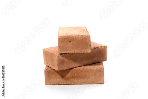 Red bricks isolated on white background. Solid clay bricks used for construction.