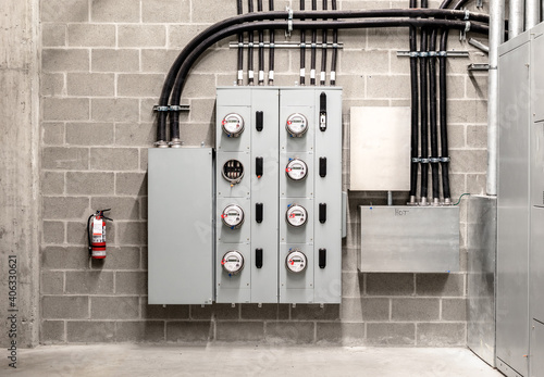 Canvas Print Electrical room with multiple smart meters, cabinets, wiring and fire extinguisher
