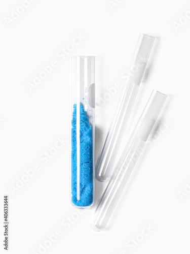 Blue flake chemicals in test tube  Copper II  sulfate. Cosmetic chemicals ingredient on laboratory table.