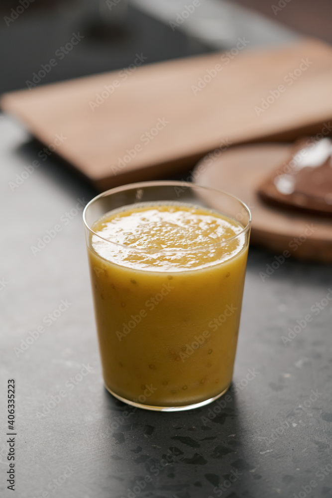 Fresh mango lulo smoothie on kitchen countertop Fresh mango lulo smoothie on kitchen countertop