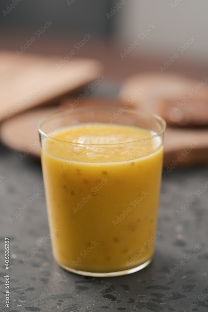 Fresh mango lulo smoothie on kitchen countertop Fresh mango lulo smoothie on kitchen countertop