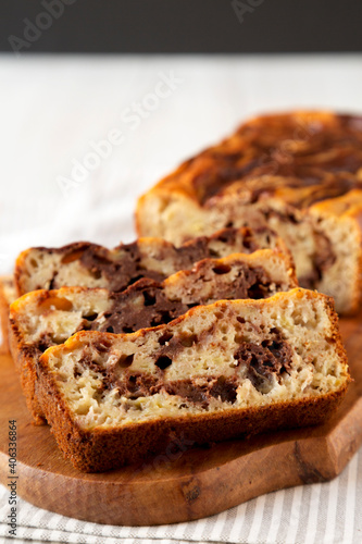 Homemade Chocolate Banana Bread on a rustic wooden board  side view.